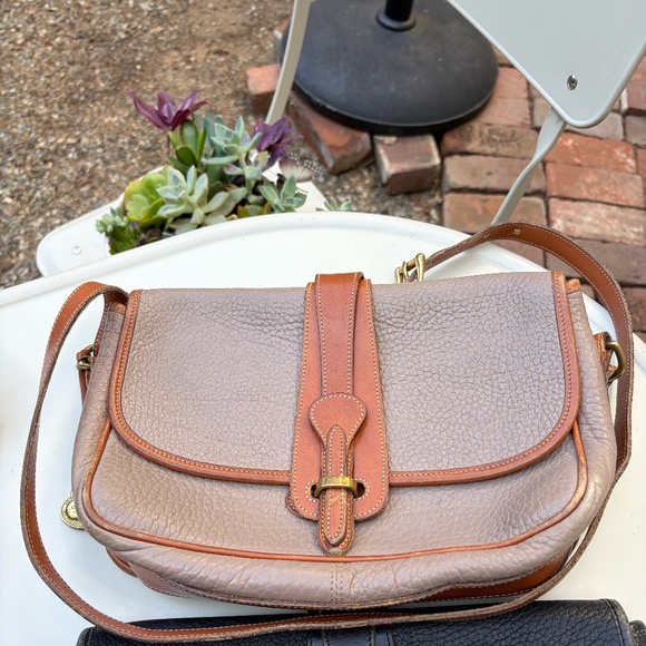 Dooney & Bourke Handbags - Vintage Dooney Bourke All Weather Leather Taupe Saddle Bag